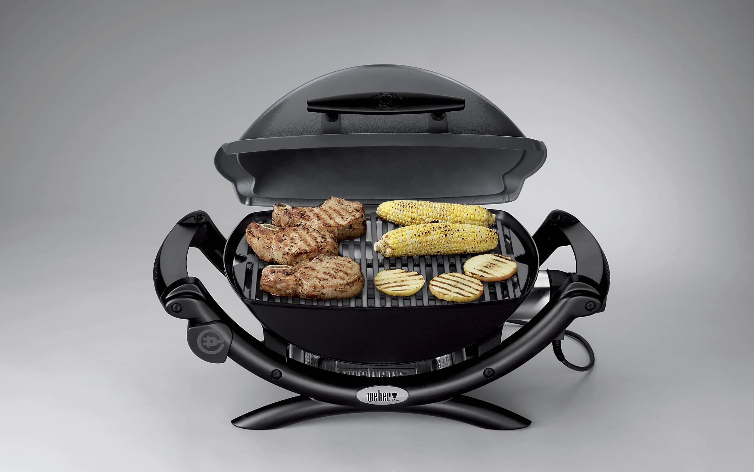 Weber Q1400 Elektryczny Grill, powierzchnia grillowania 43 x 32 cm, przenośny BBQ Grill,2-częściowy żeliwny ruszt pokryty emalią porcelanową, pokrywa i obudowa aluminiowa - Ciemnoszary (52020079)